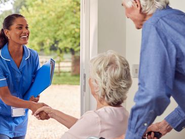 Nurse warmly greeting elderly couple at their home.