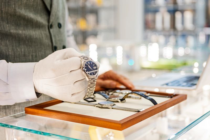 Senior man in jewelry store selling luxury watches