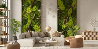 Modern living room with earthy tones and green moss wall art.