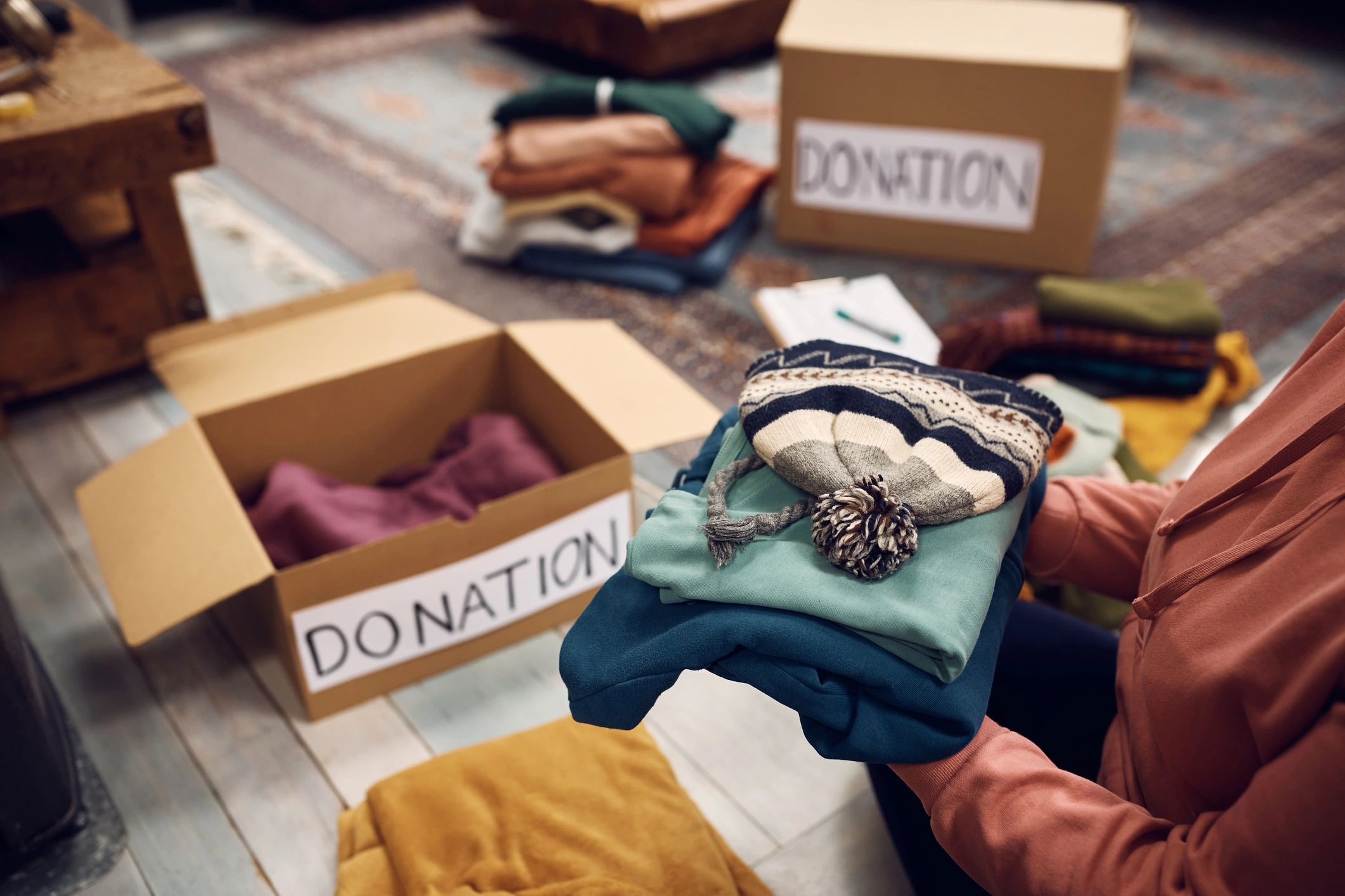 Preparing clothing donations for charity.
