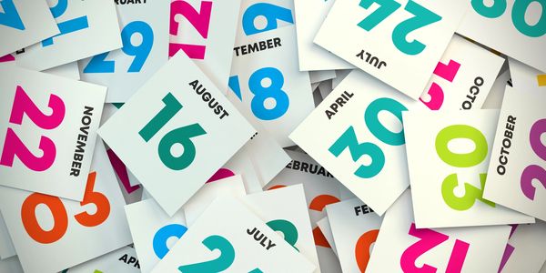 Scattered calendar date cards showing various months and days.
