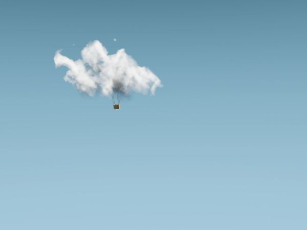 A single cloud in a clear blue sky with a small object hanging below it.