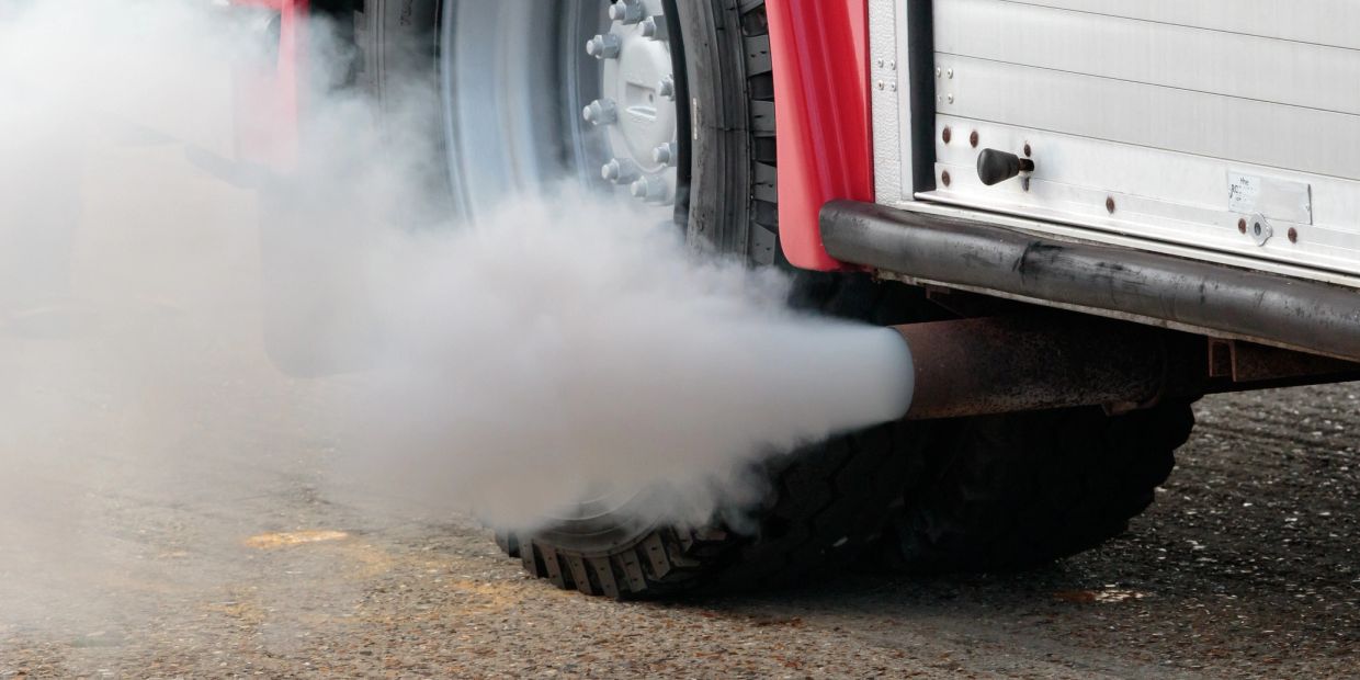 Smoke emitting from a vehicle's exhaust pipe.