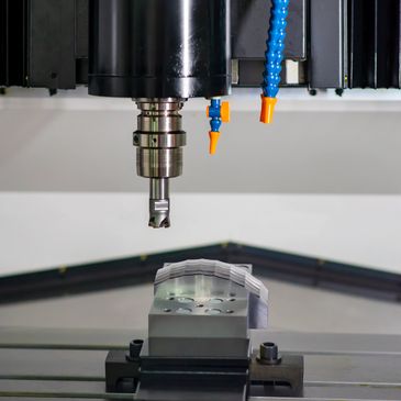 Close-up of CNC milling machine cutting a metal workpiece.