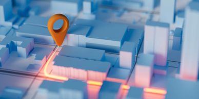 3D city map with an orange location pin and glowing route.