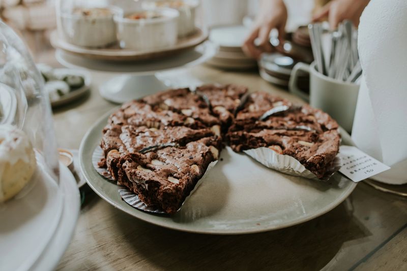 Plate of brownies, on counter in homemade cafe.