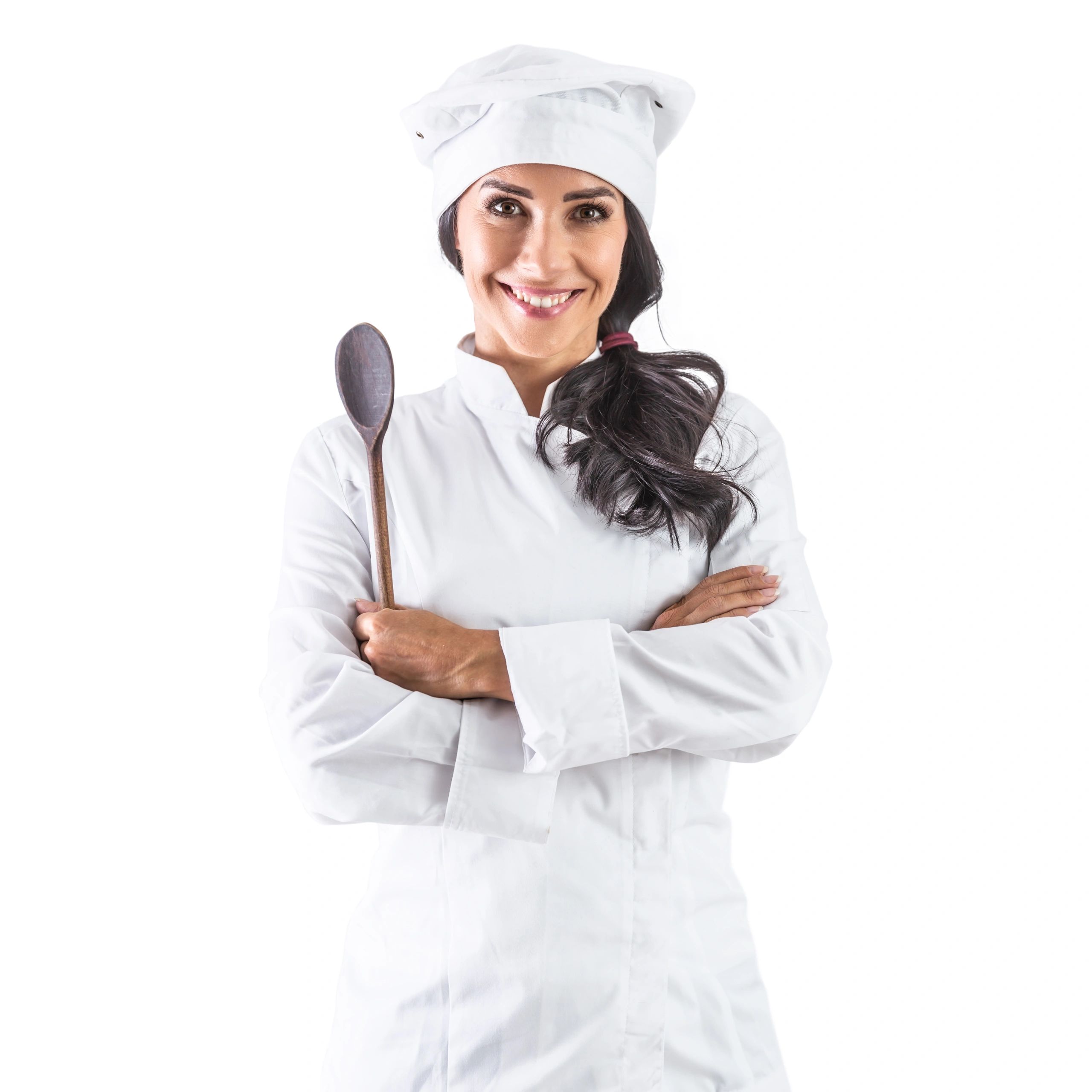 Smiling female chef in white uniform holding a wooden spoon.