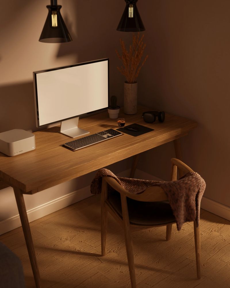 Modern home working area interior design with pc computer white screen mockup and accessories on wood table and wood armchair. 3d rendering, 3d illustration