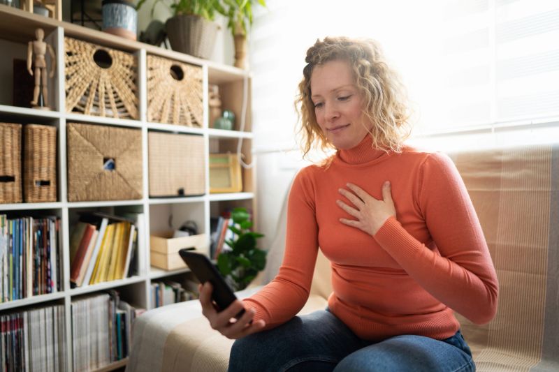Caucasian woman having a video call with doctor on mobile phone