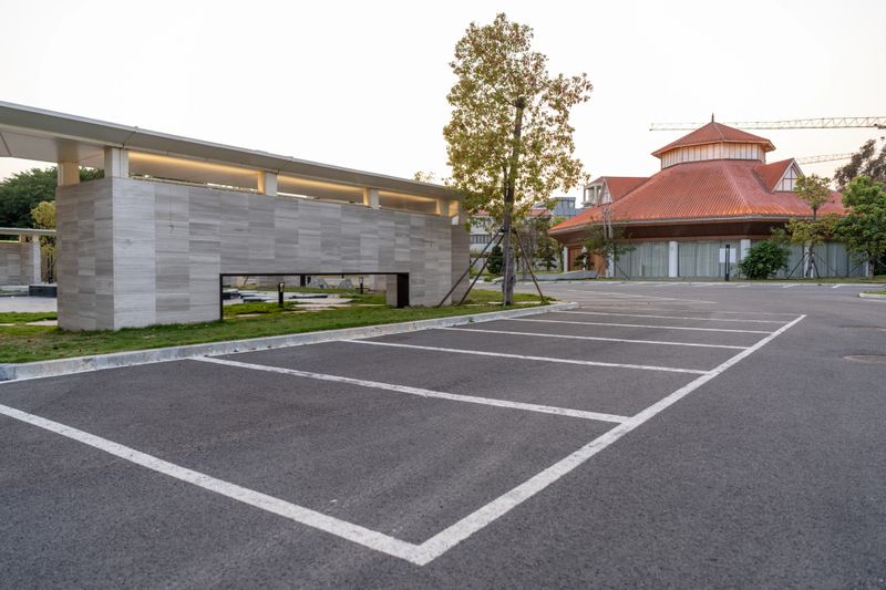 A parking lot on an asphalt road with a scribed line