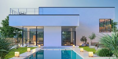 Modern house with a pool and outdoor seating area.