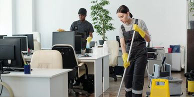 Cleaners mopping business office spaces