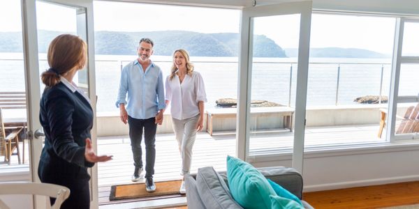 A woman meeting a couple for home design