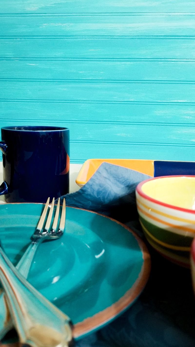 Festive colorful dishes with turquoise background.