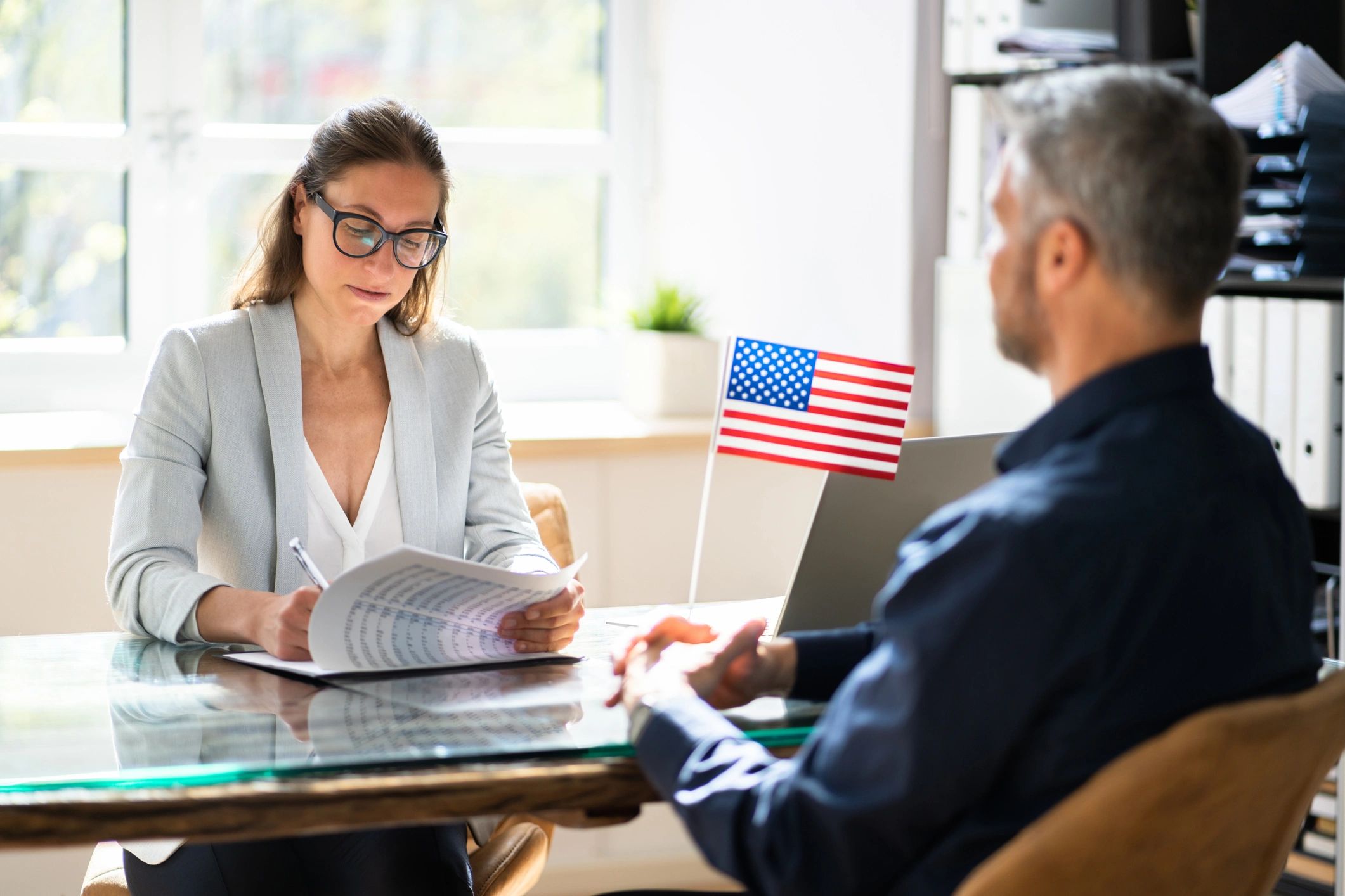 Interview or consultation with an American flag.