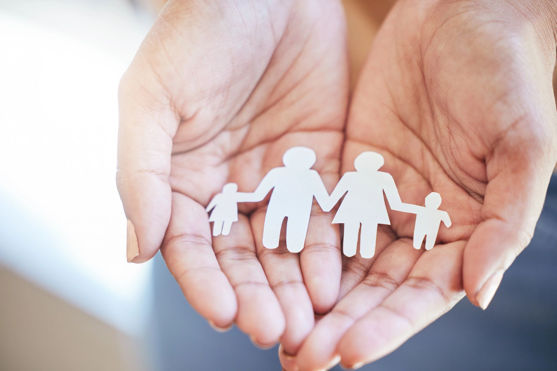 Hands holding paper family - support for custody, divorce, and legal forms in Arizona
