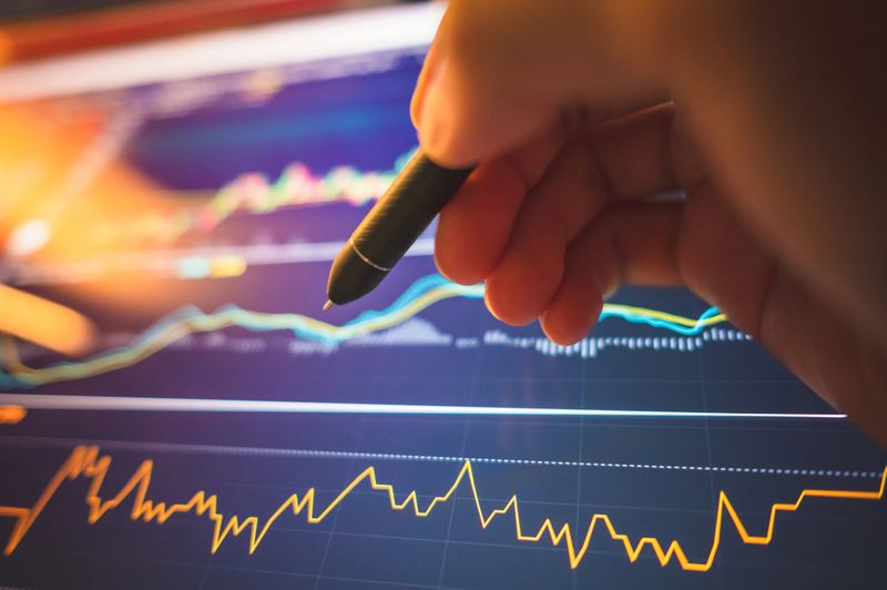 Business person holding pen indicator business model analysis Digital asset cryptocurrenciees Sustainability investment selective us dollar bond and fund stable coin