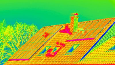 Thermal image of a house roof showing heat patterns.