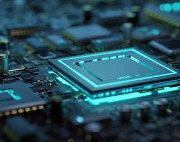 Close-up of a glowing microchip on a circuit board.