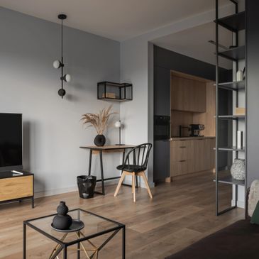 Modern living room with minimalist furniture and neutral tones.
