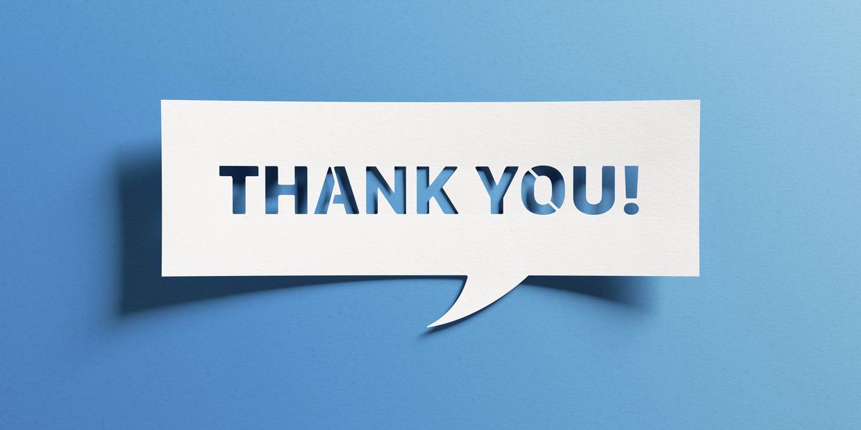 A white speech bubble with "THANK YOU!" cut out, casting a shadow on a blue background.