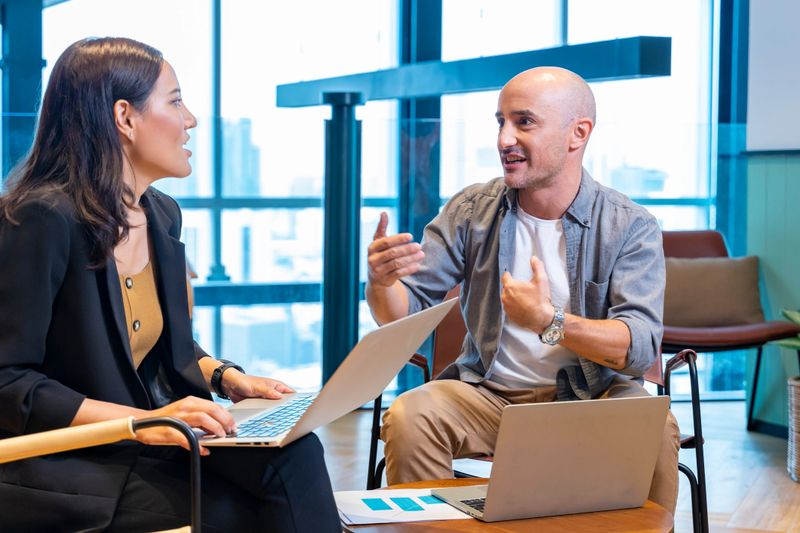 Customer is listening to banker suggestion on mutual fund that he would like to invest for investment and financial advice