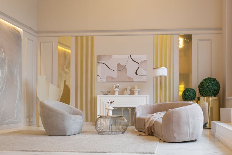 the latest fashion home trends in an ultra modern elegant interior of a cozy studio in soft pastel colors. close-ups of a stylish living area with golden elements