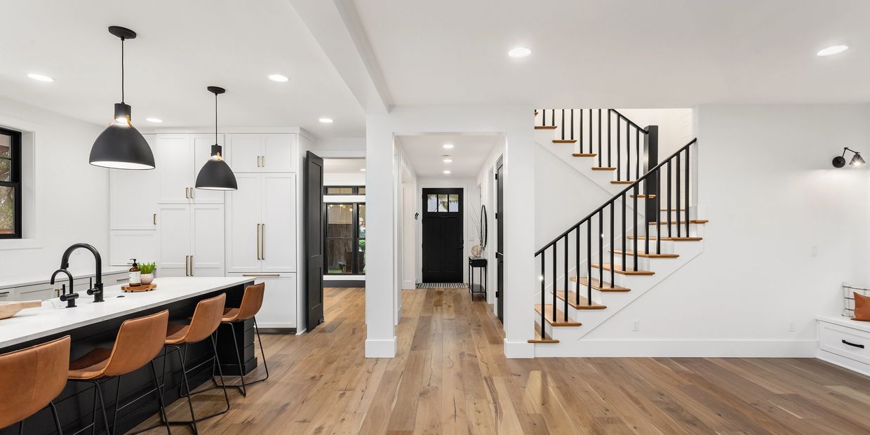 Bright Kitchen, looking towards the front door. The Hardwood floor runs the whole floor. 