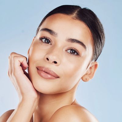 Close-up of a woman with clear skin and natural makeup.