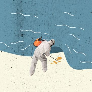 Person in hazmat suit spraying toxic symbol on the ground near water.