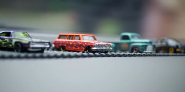 Toy cars lined up on a surface.