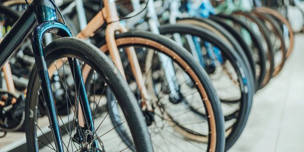 Row of bicycle wheels lined up.