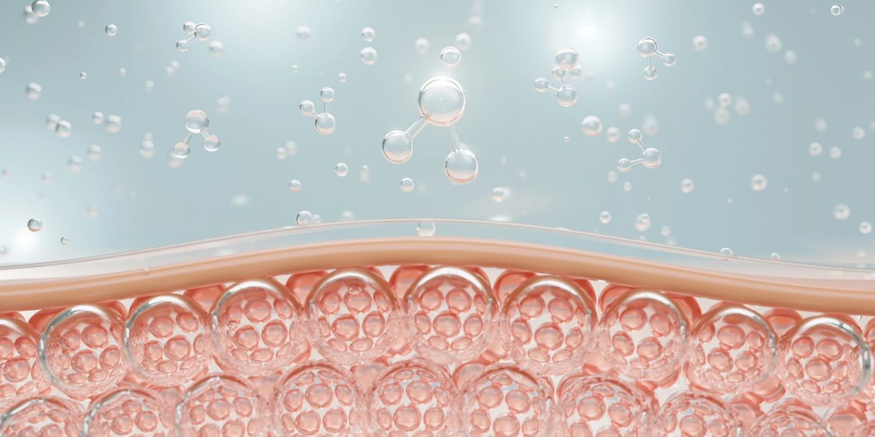 Three-dimensional molecular structures floating above pink spheres.