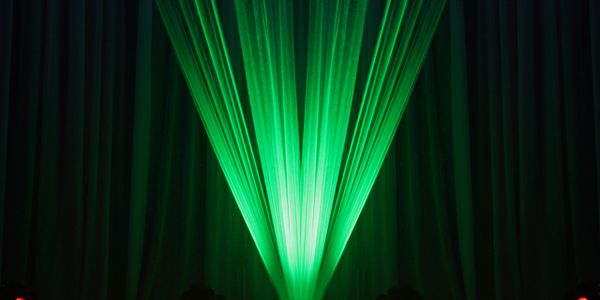 Green and red stage lights creating a dramatic effect.
