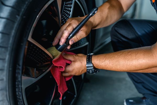 Brushing the wheels of the car