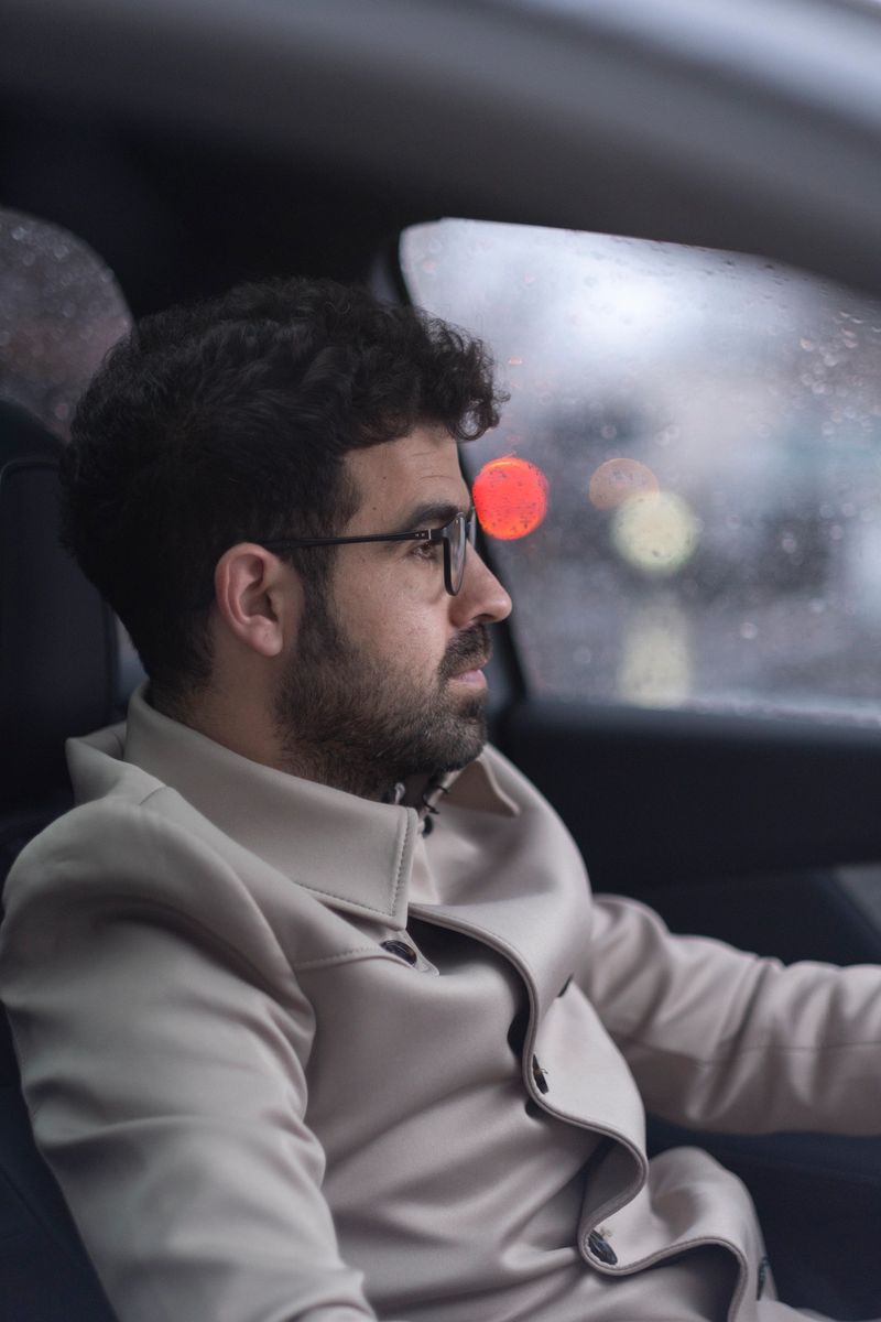 Man driving car on the road.