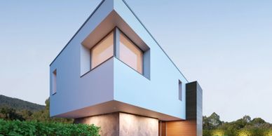 Modern angular house with large windows and minimalist design.