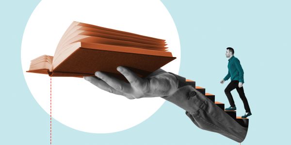 Man climbing stairs formed by a giant hand holding an open book.