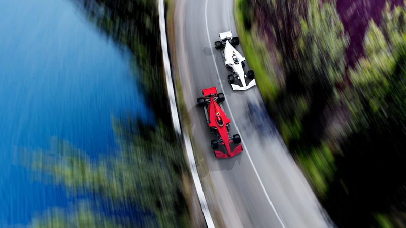 top view of fast moving generic red race car leading  group on a race track, motion blur,  3D, car of my own design.