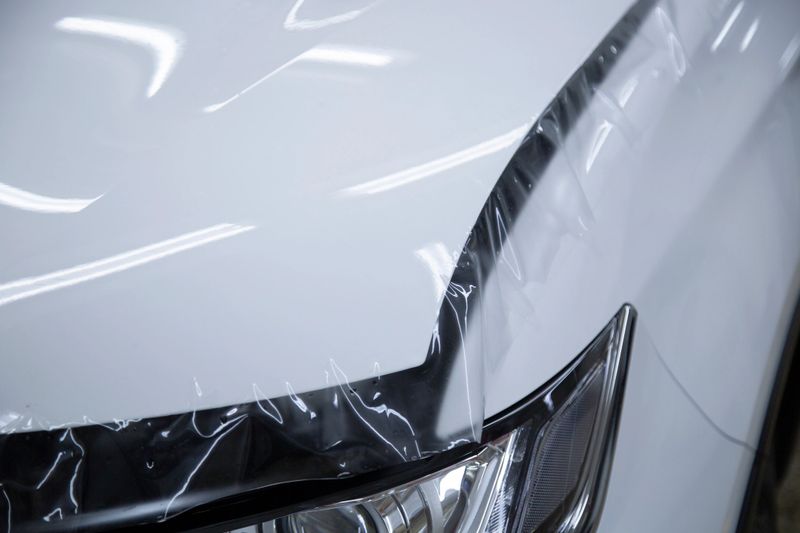 Installation of a protective film on the car body.Protection of the paintwork.