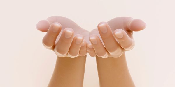 Two hands cupped together against a soft background.