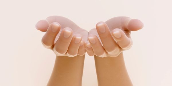Two hands cupped together against a soft background.