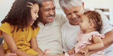 Happy grandparents with their two granddaughters.