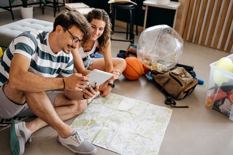 Couple planning vacation trip, searching places to visit