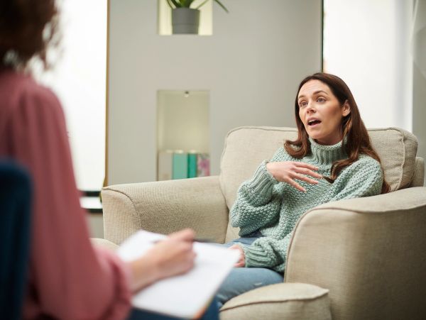 Woman talking to a therapist during a counseling session.