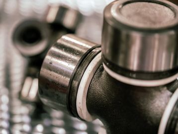 Close-up of a metal universal joint with bearings.