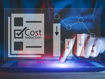 Person using tablet with digital cost reduction graphics.