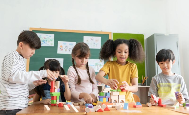 Children joyfully engaging in interactive learning activities at Wonder Nest Academy.