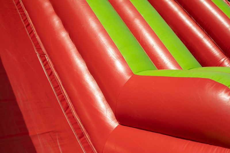 Children's fun in summer. Inflatable trampoline for jumping. Rubber construction.