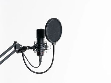 Black microphone on a white background
